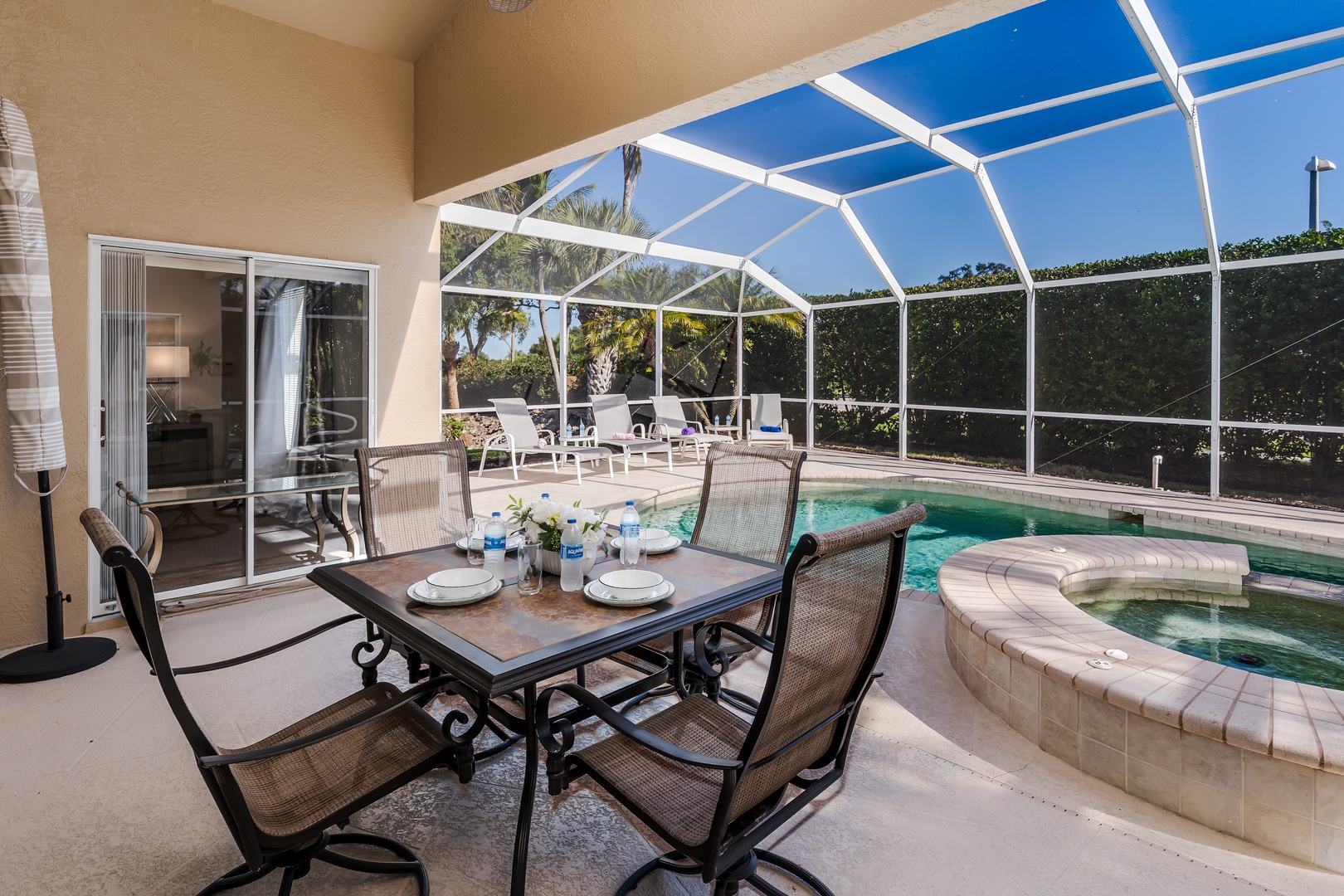 Your screened lanai creates the perfect dining oasis with pool views and refreshing outdoor comfort.