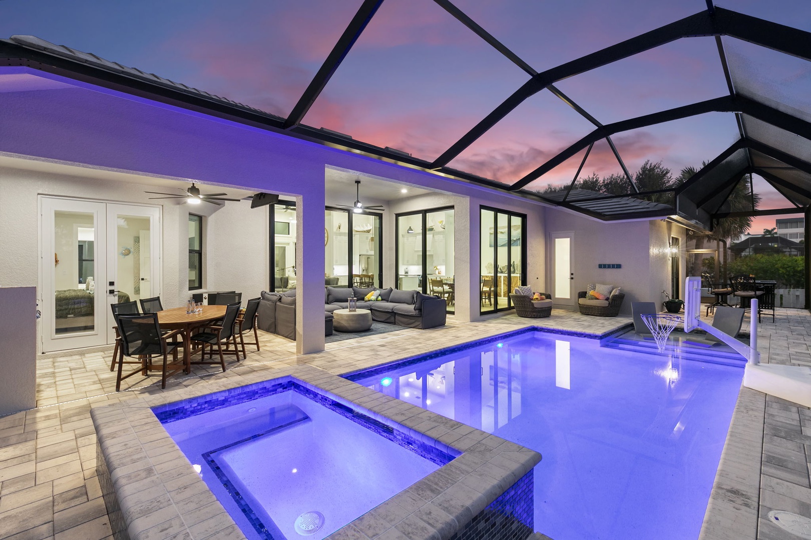 A stunning twilight sky frames this private oasis where relaxation meets modern luxury. Watch the sunset from the pool or hot tub, then unwind on spacious outdoor lounges.
