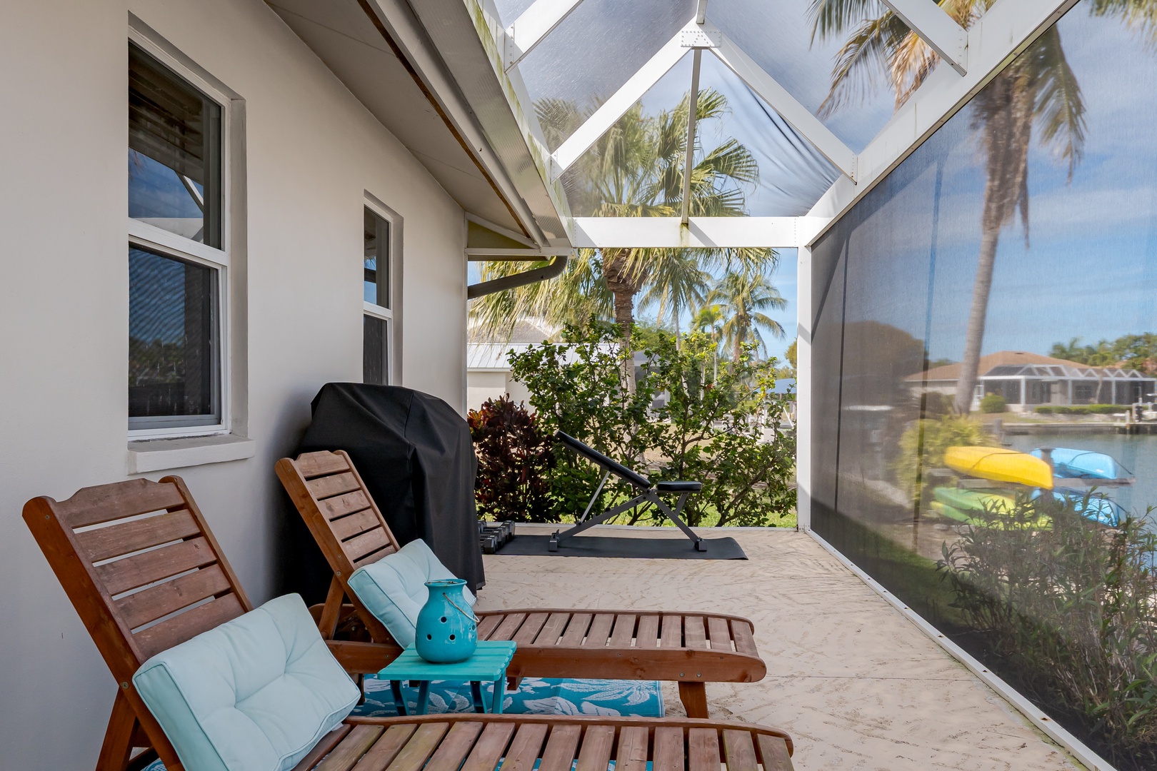 Relax on your screened lanai with waterfront views and lounge chairs perfect for morning coffee or evening unwinding.