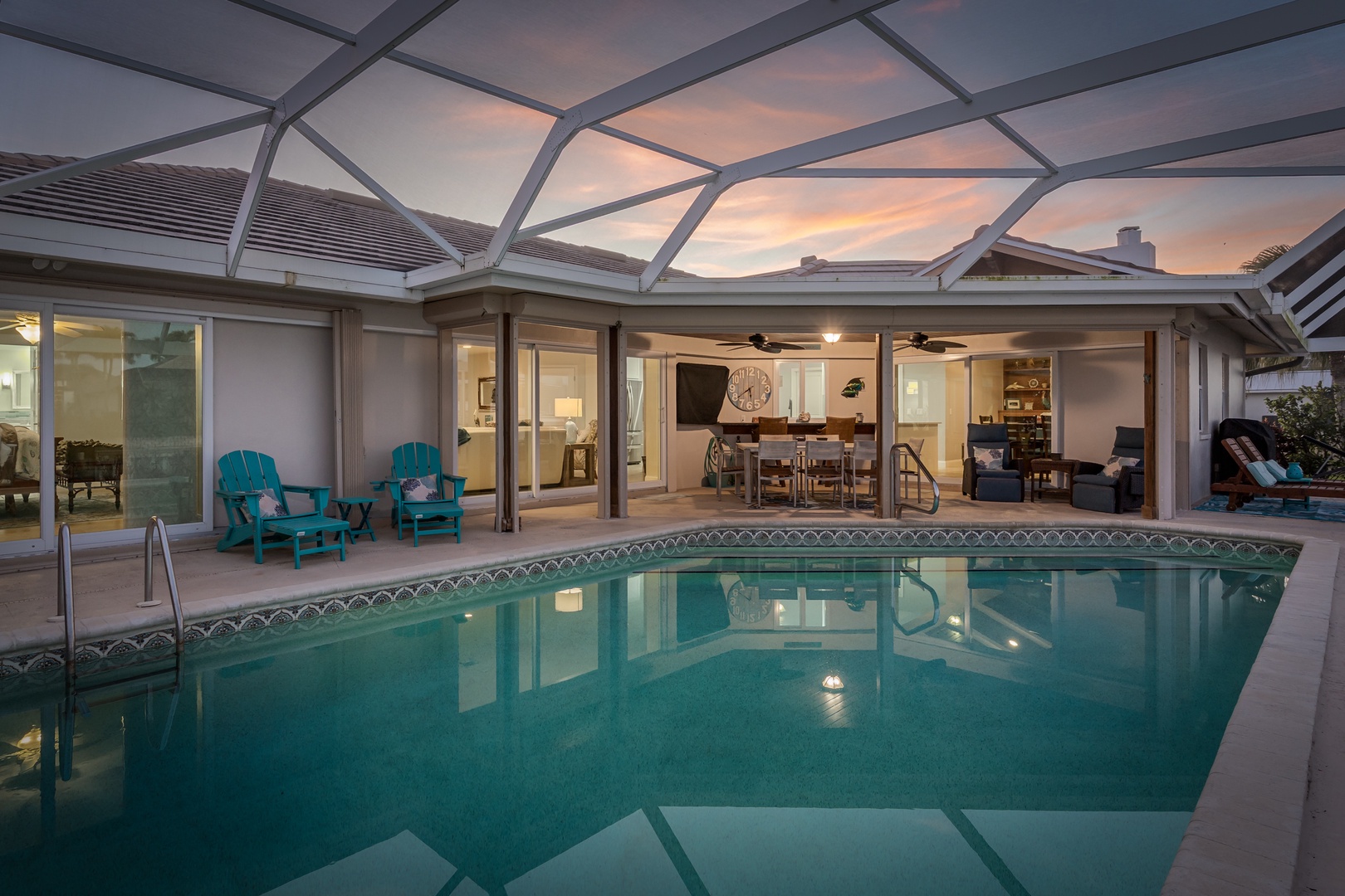 Your private pool oasis awaits under glass, perfect for evening swims as sunset colors paint the sky overhead.