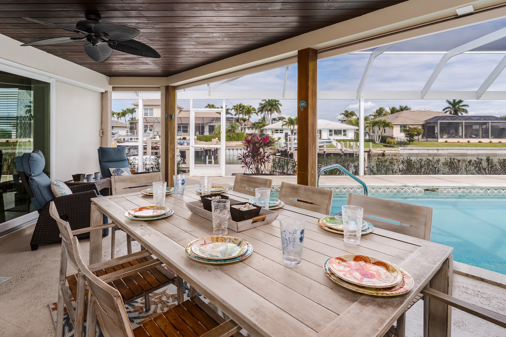 Your covered dining area opens to sparkling pool waters, where tropical breezes and water views create the perfect breakfast setting.