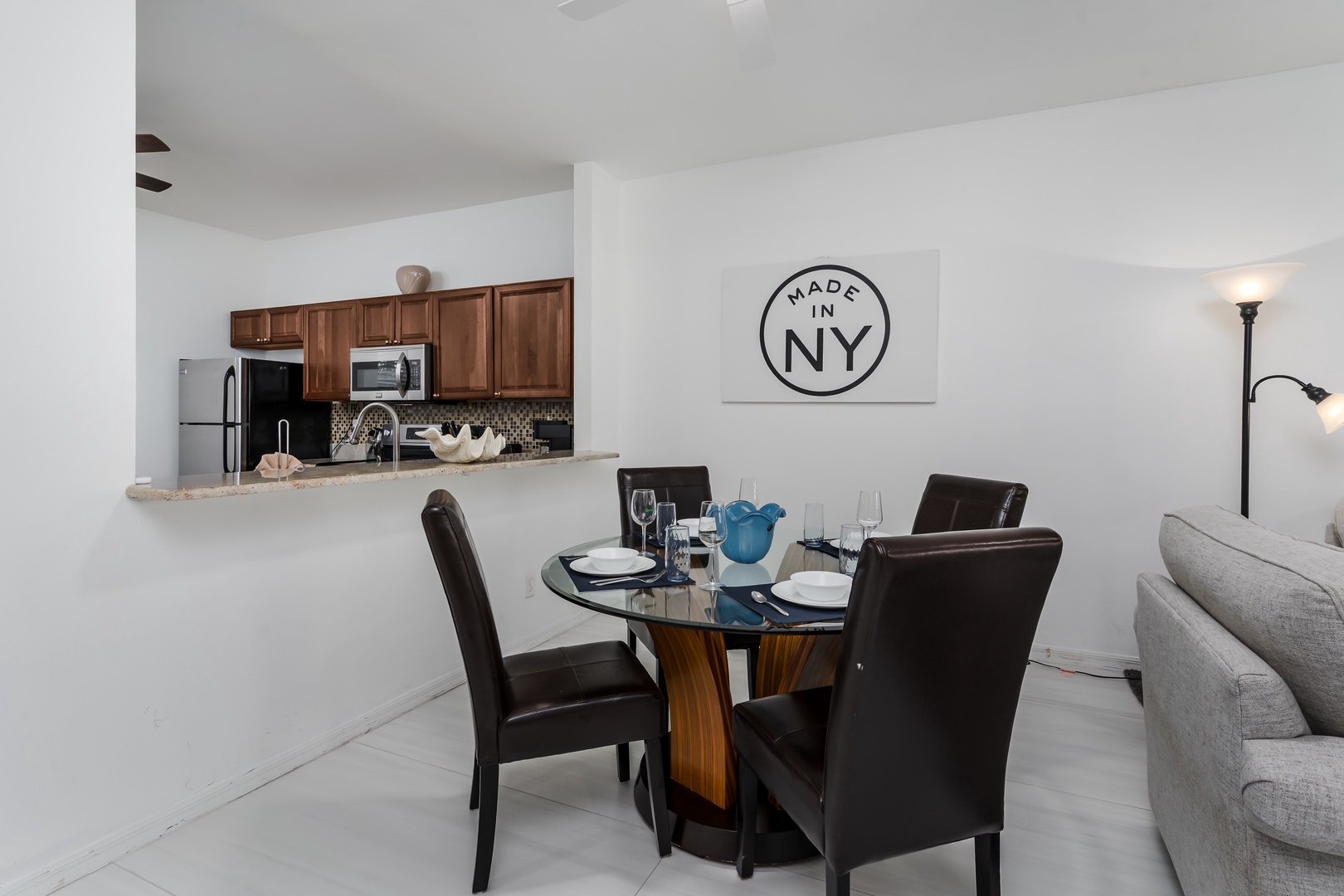 Step into your inviting open-concept living space where modern comfort meets thoughtful design. The dining area flows seamlessly into the kitchen, making it easy to gather, cook, and share memorable meals in style.