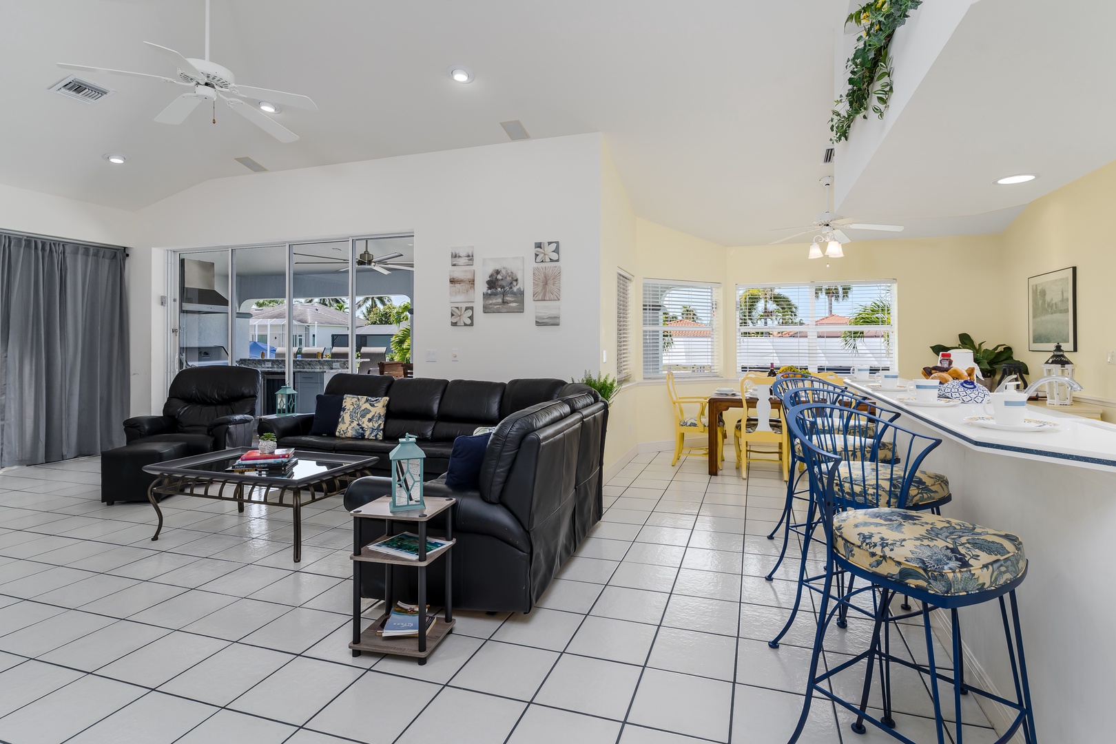 Unwind in your spacious open-concept living area, where comfortable seating and natural light create the perfect spot to relax after a day of adventure, with easy access to your private patio just steps away.