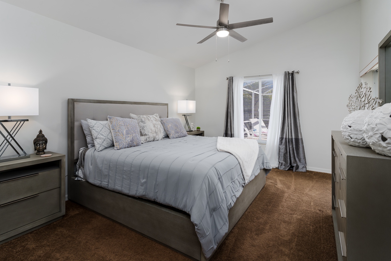 Sink into plush bedding in this serene bedroom, where soft linens and modern furnishings create your perfect retreat.