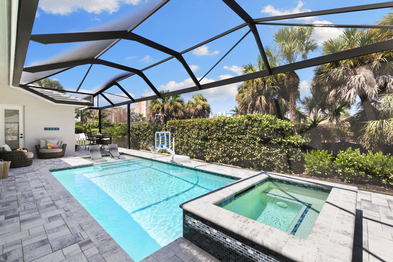 Soak up the sunshine in your private screened pool and spa, surrounded by tropical palms and lush greenery. The perfect spot to cool off, lounge, and enjoy the warm Florida weather in total privacy.