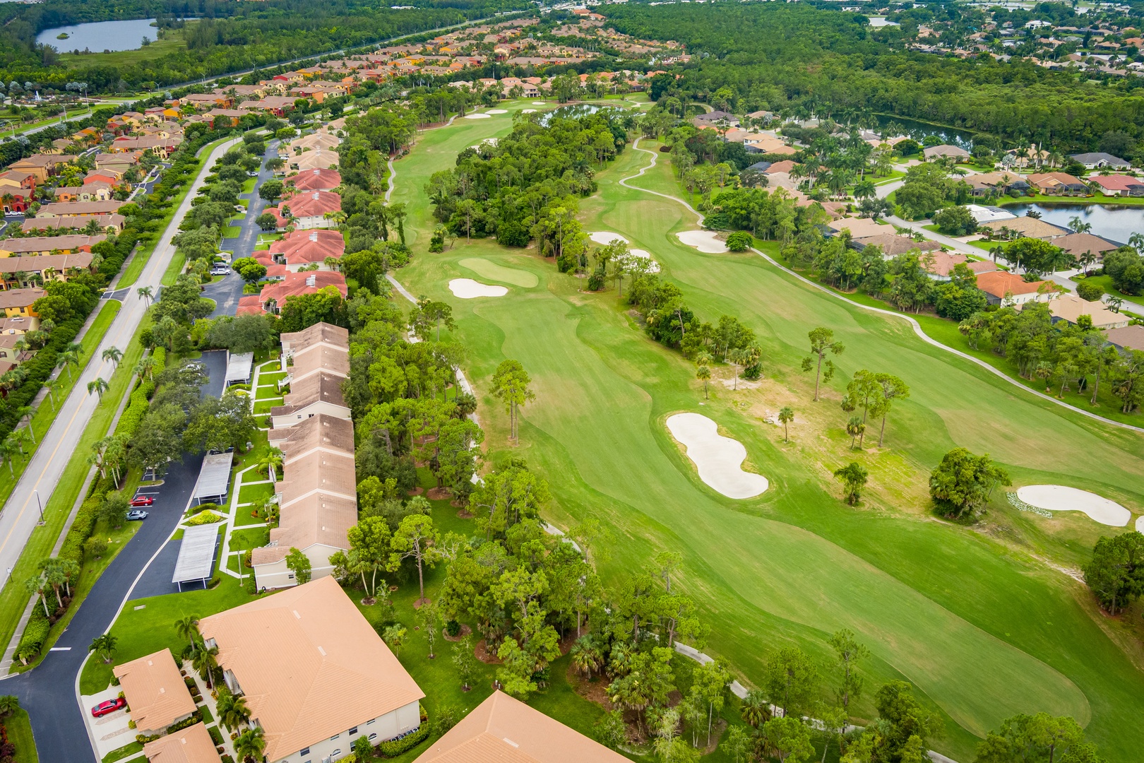 The property sits within a lush community featuring manicured fairways, pristine greens, and scenic lake views amid abundant greenery.