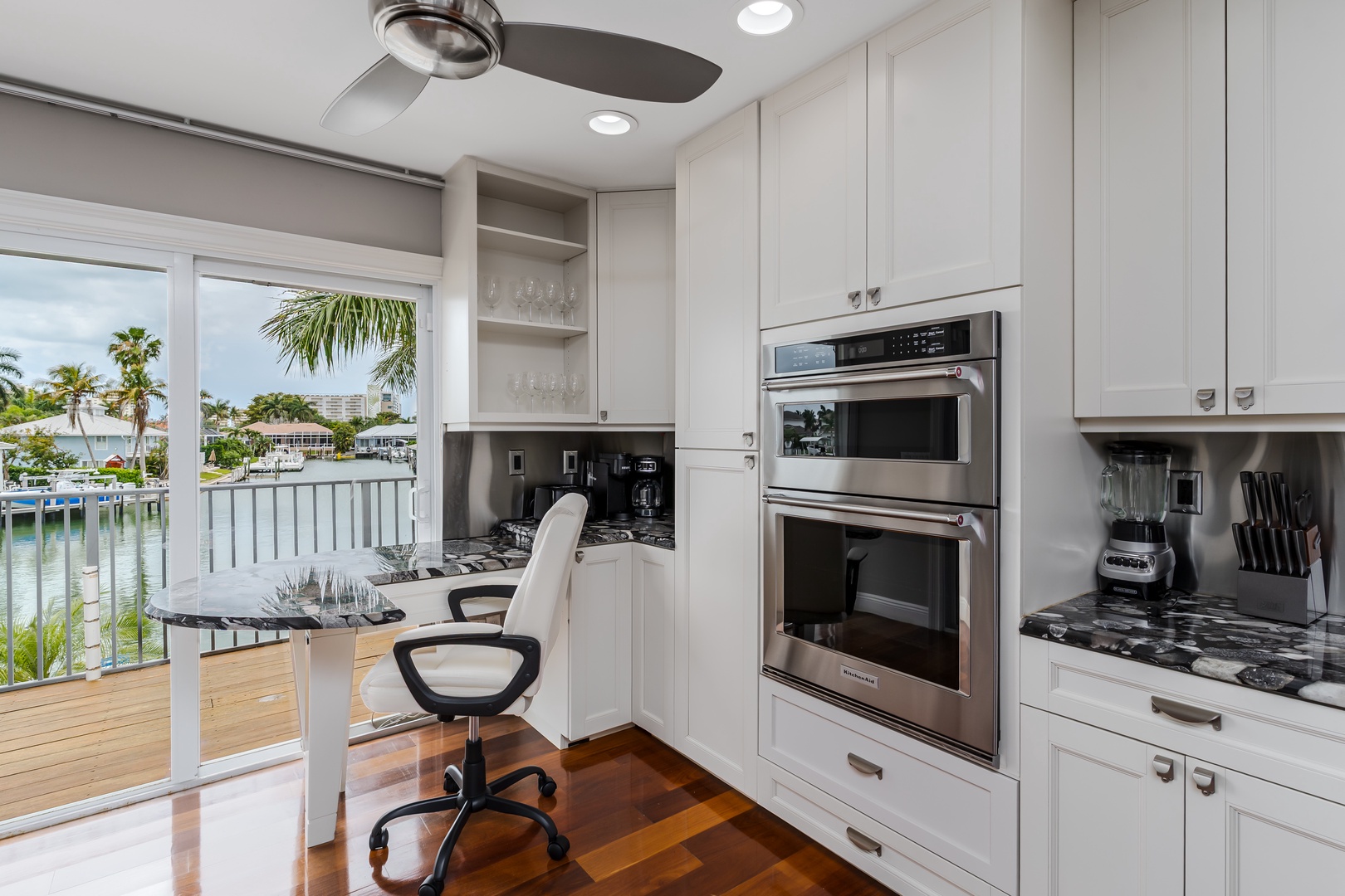Your fully equipped kitchen features modern appliances and opens to a stunning waterfront view—perfect for preparing meals while soaking in the tropical scenery.