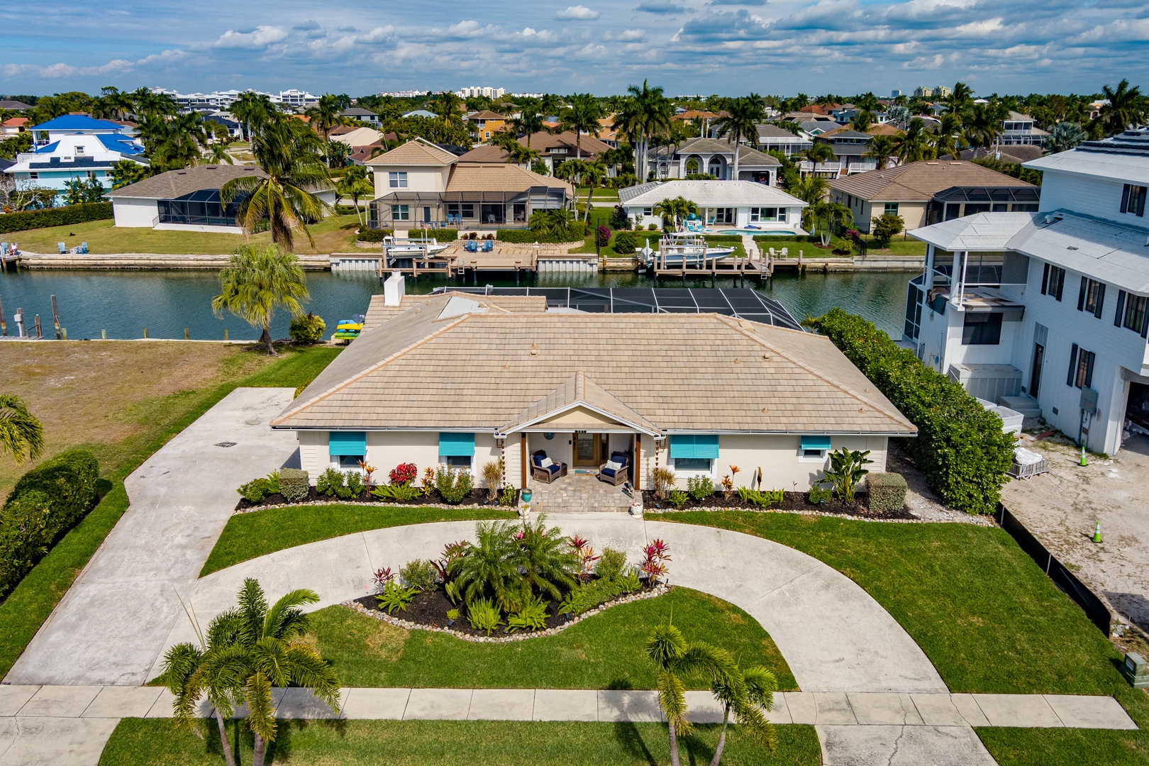 Waterfront property with tropical landscaping and canal access in this peaceful residential neighborhood.