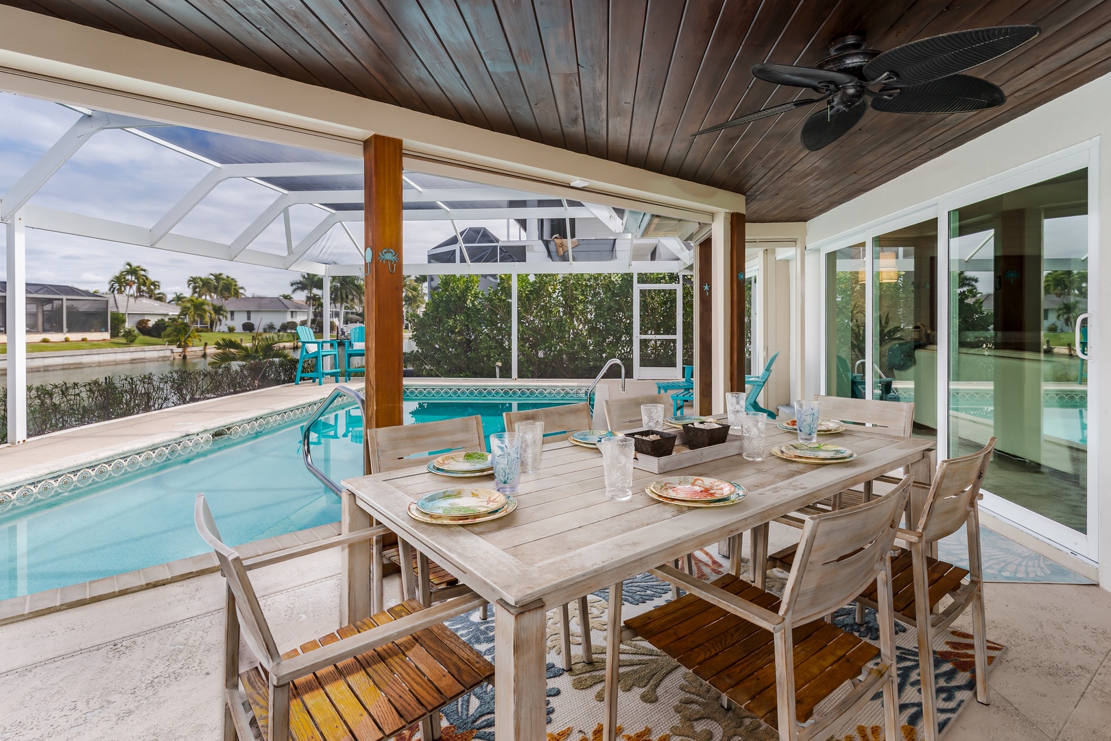 Dine poolside under your covered terrace, where warm wood ceilings and sparkling water create the perfect backdrop for memorable meals.