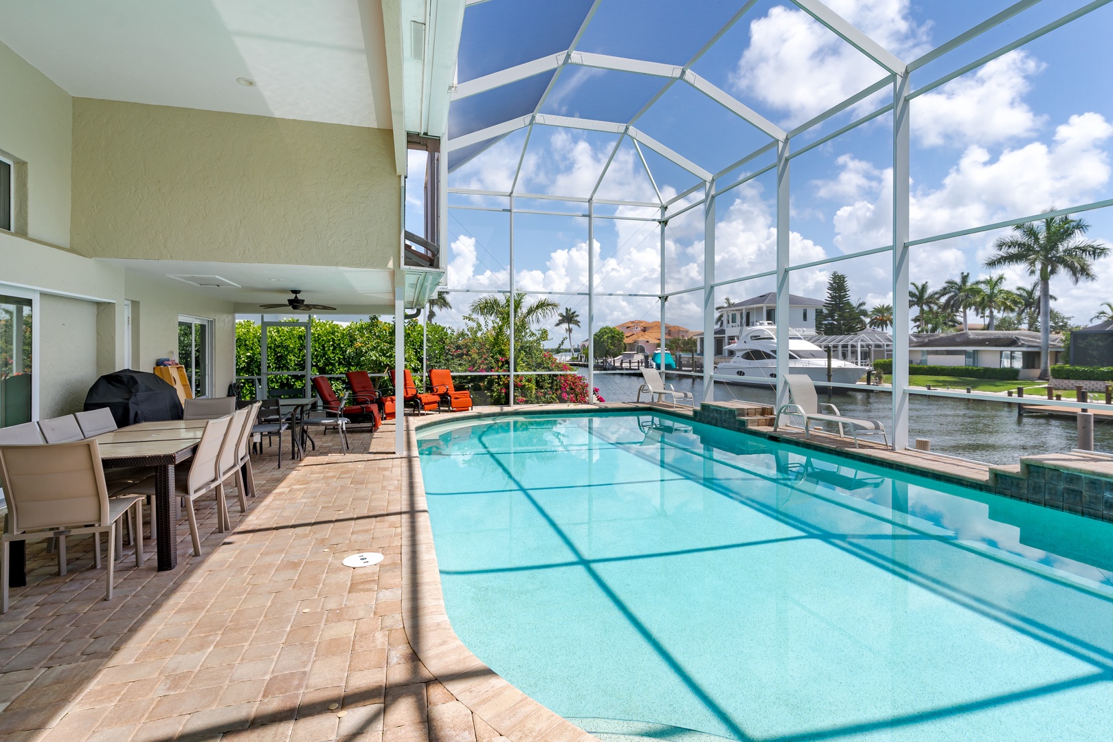 Your private pool sanctuary awaits under a soaring glass enclosure, where you'll swim surrounded by tropical views and endless blue skies.