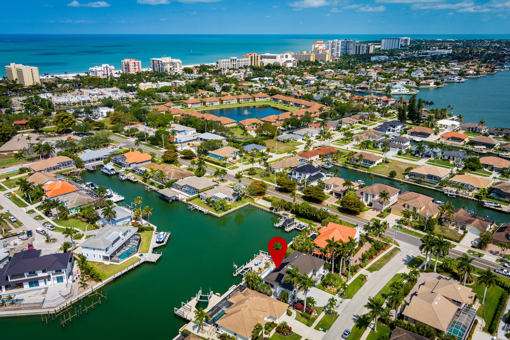 Scenic waterfront neighborhood features canal-lined streets, private docks, and easy access to the beach and Gulf of Mexico.