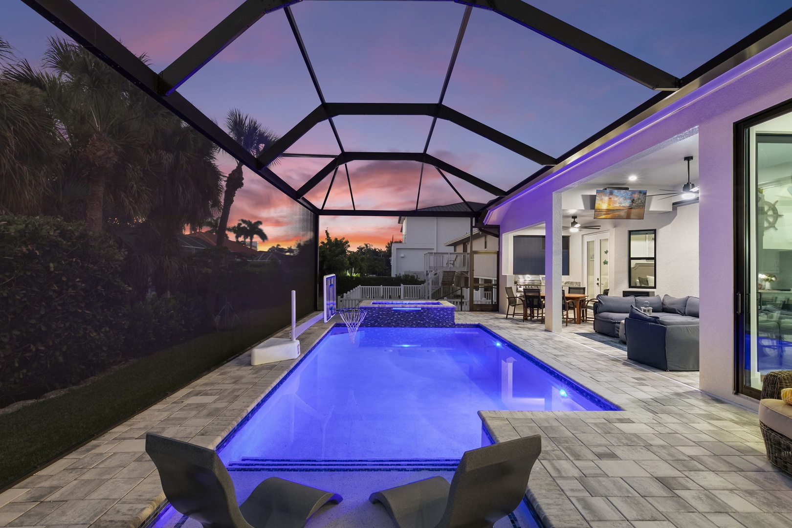 Step outside to your private pool glowing under a stunning Florida sunset, where warm evenings and relaxed outdoor living become your daily escape.