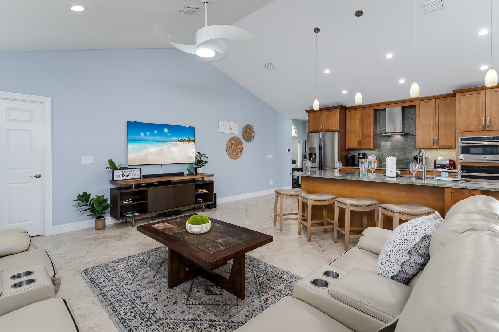 Your open-concept living space flows seamlessly from cozy seating to a fully equipped kitchen, perfect for entertaining and relaxing together.