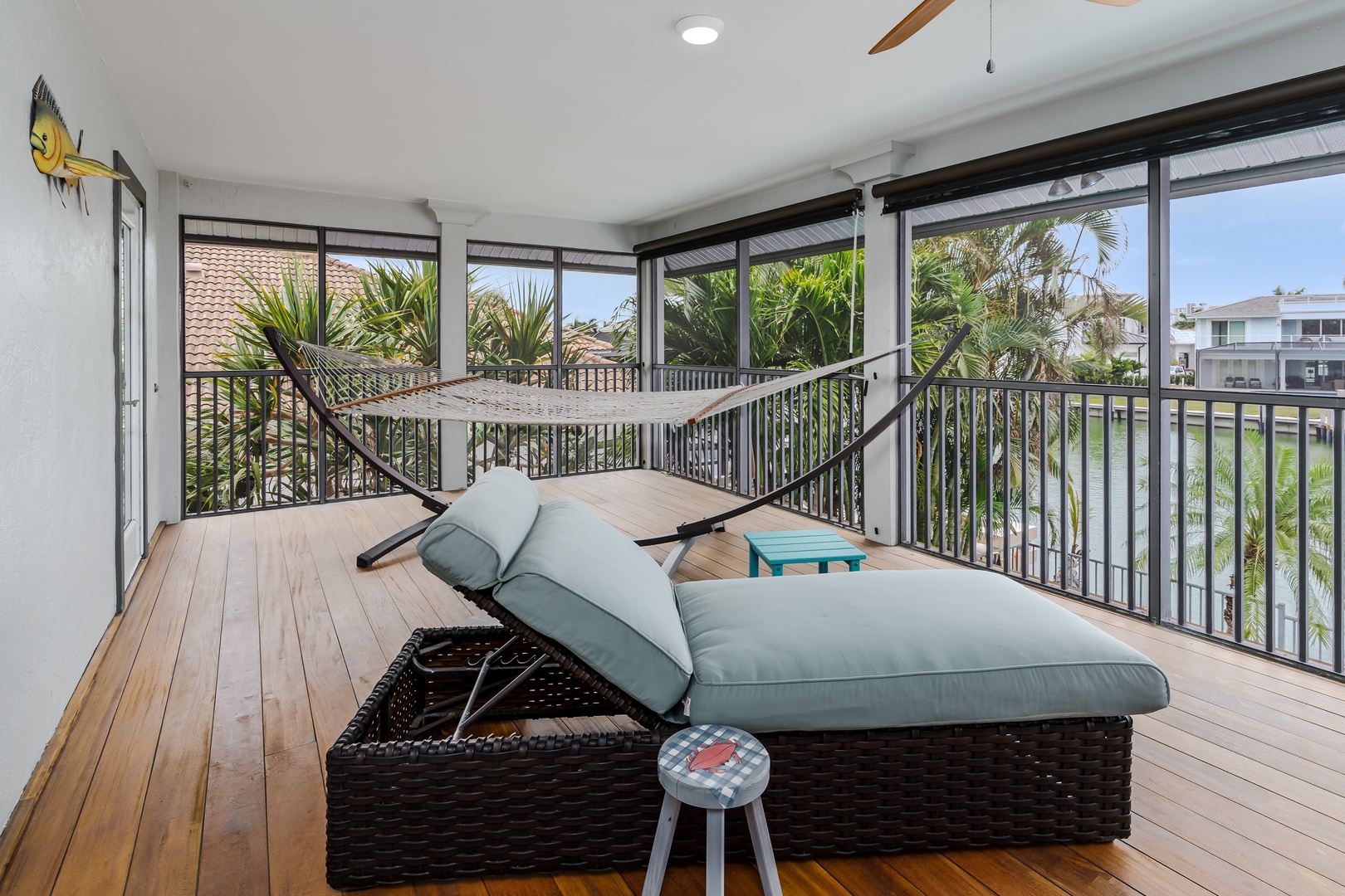 Imagine lounging on this screened balcony with tropical breezes and a hammock ready for your ultimate relaxation. The perfect spot to unwind with your morning coffee or afternoon book.