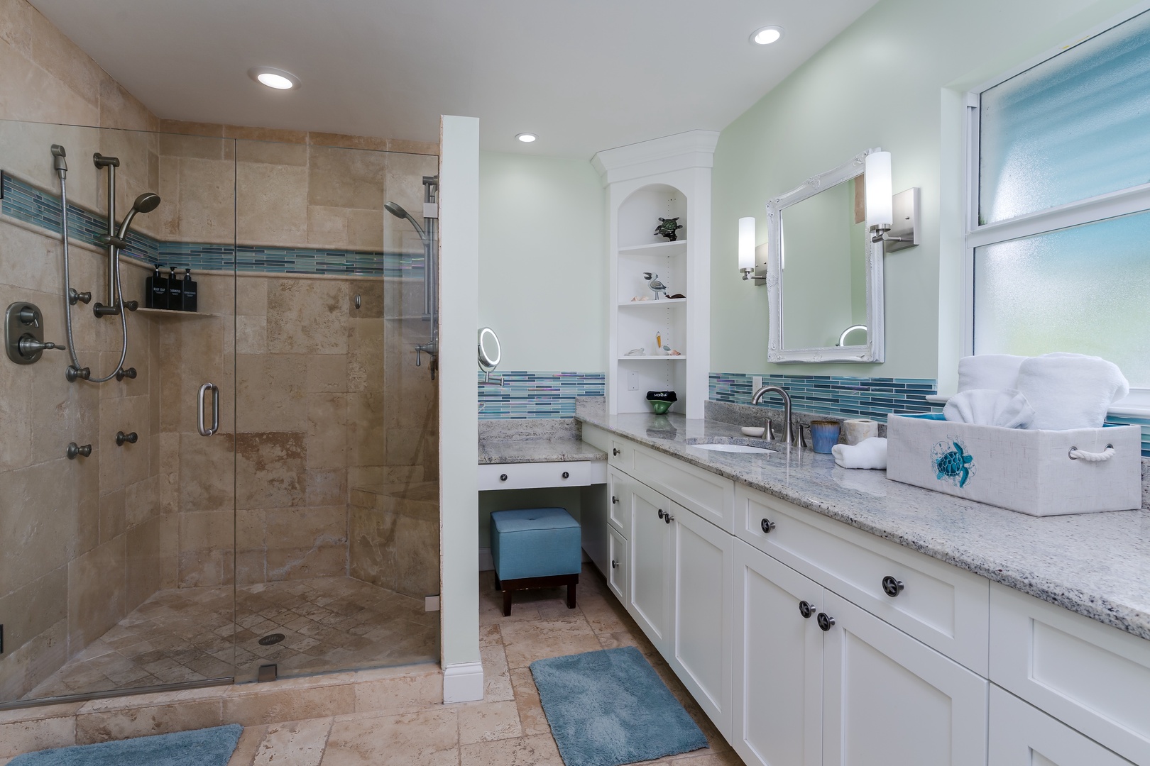 Unwind in your spa-inspired bathroom with walk-in shower, dual vanities, and elegant ocean-blue accents throughout.