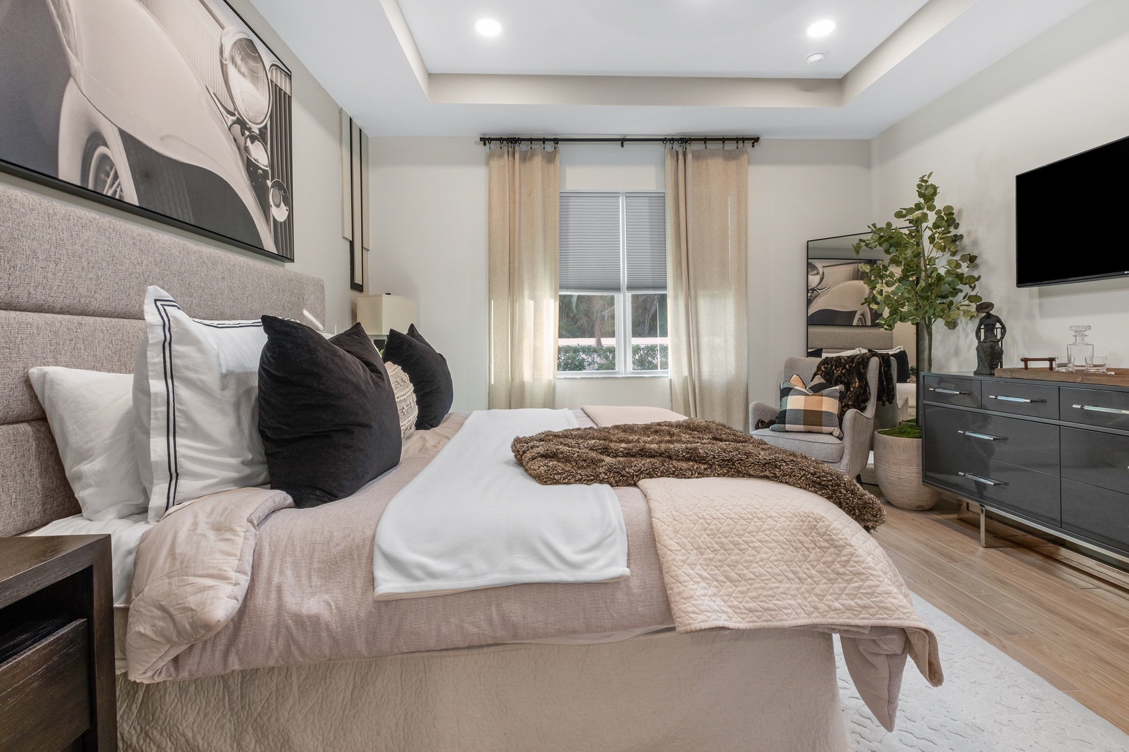 Sink into plush linens and luxurious textures in your serene bedroom sanctuary, where modern elegance meets ultimate comfort.