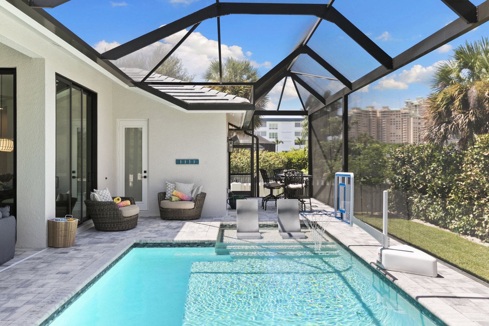 Slip into your private screened pool under Florida sunshine, surrounded by lush landscaping. Lounge on comfortable seating or cool off with a quick dip—your perfect retreat awaits.