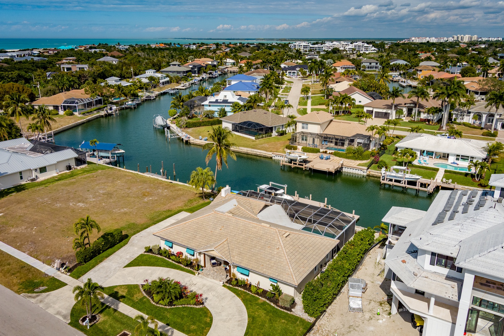 Waterfront canal community with private boat docks and tropical landscaping, minutes from pristine beaches and resort areas.