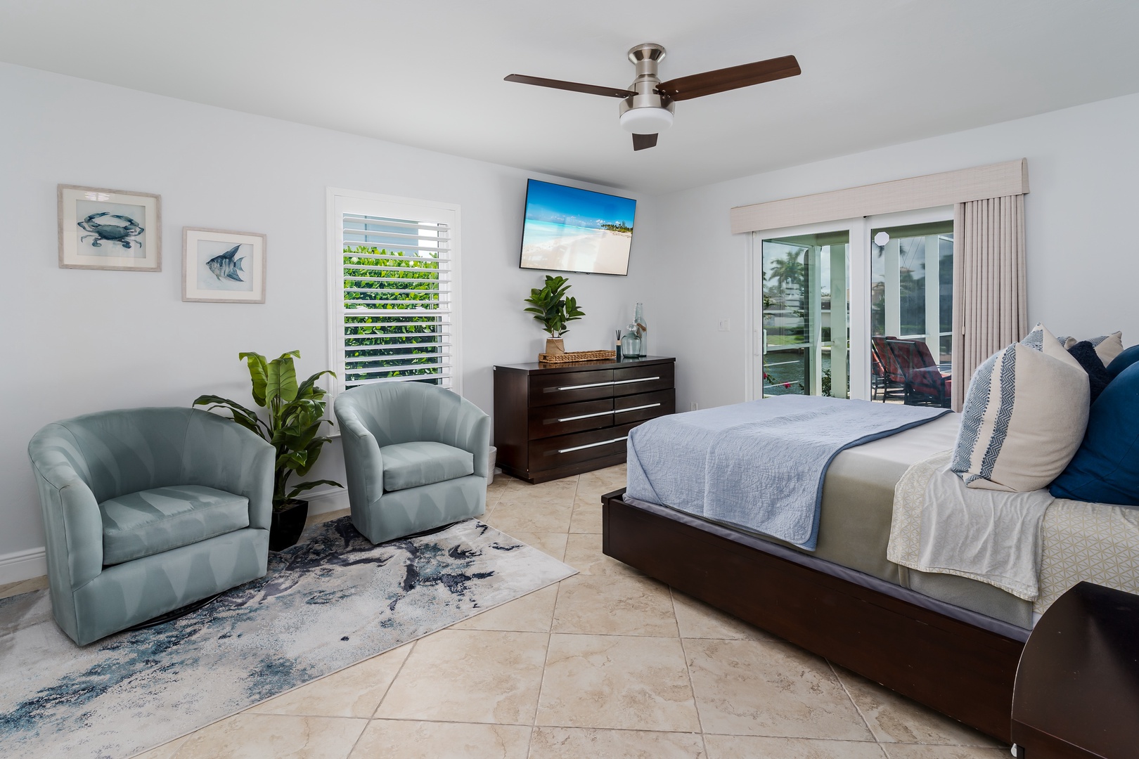 Drift into coastal dreams in your serene bedroom, complete with plush seating and tropical breezes from your private balcony.