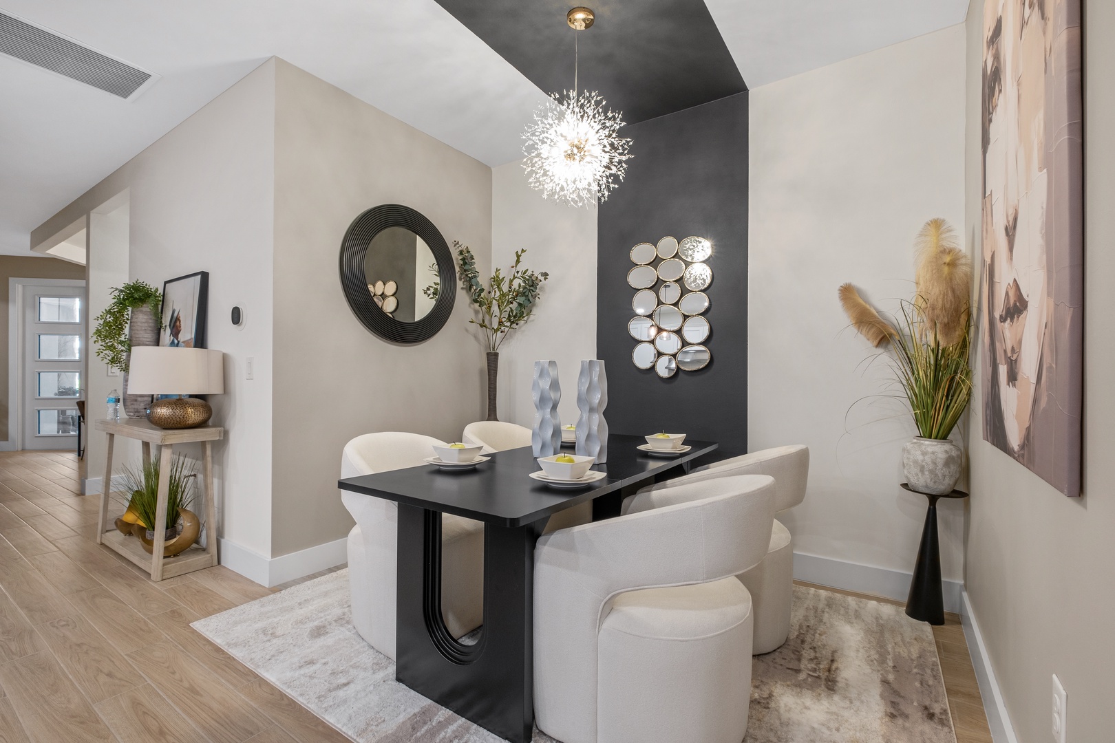 Your elegant dining space features a striking modern table, plush seating, and designer touches that create the perfect setting for memorable meals.