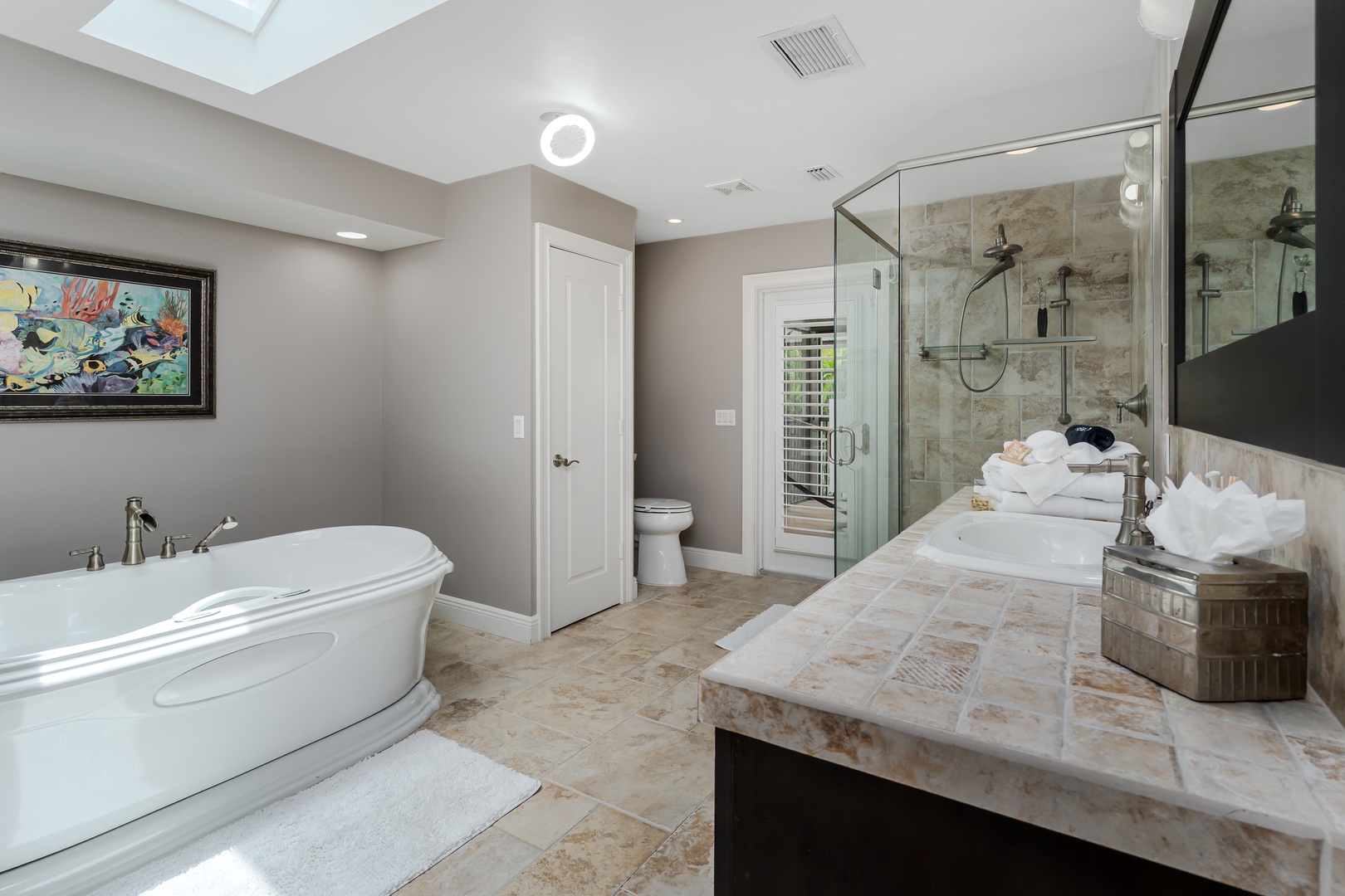 Your luxurious retreat features a soaking tub, walk-in shower, dual vanities, and elegant marble finishes to elevate your daily routine.