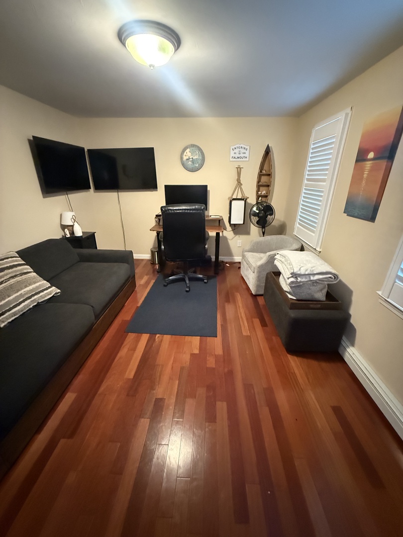 Settle into your stylish workspace with warm wood floors and sleek modern furnishings.