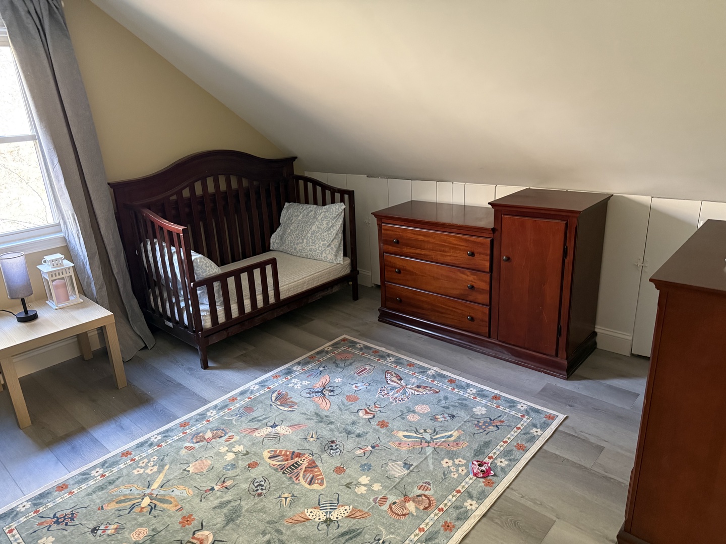 Your little one will love this cozy nursery with its charming crib and plenty of storage for all their treasures.