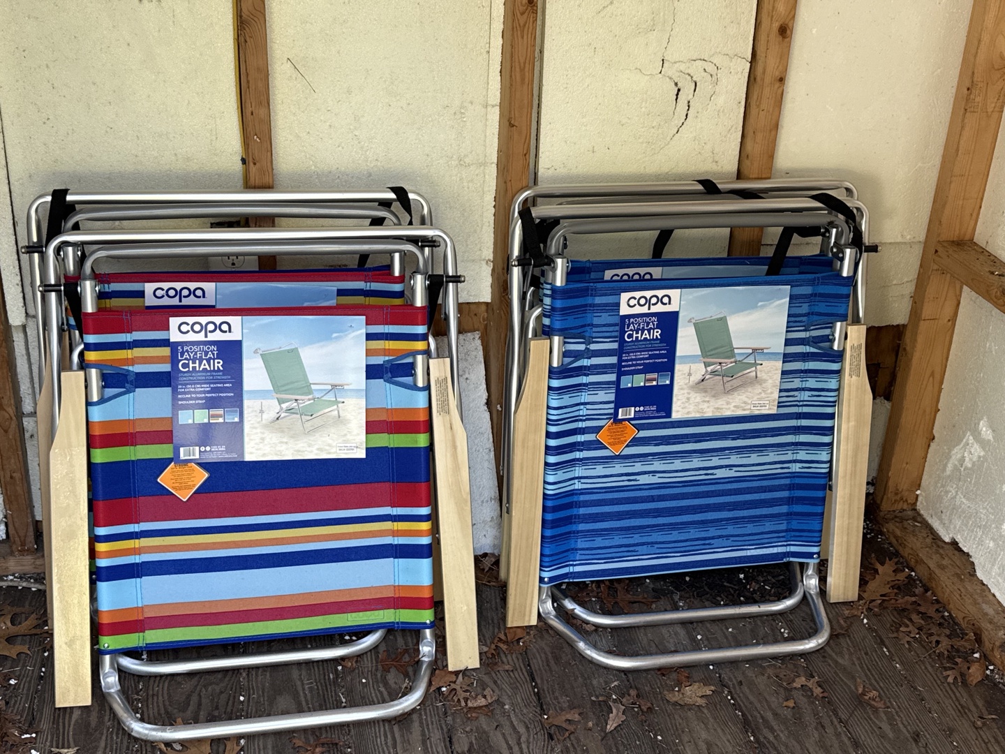 Folding beach chairs rest against the exterior wall, ready for your next seaside adventure or poolside afternoon.