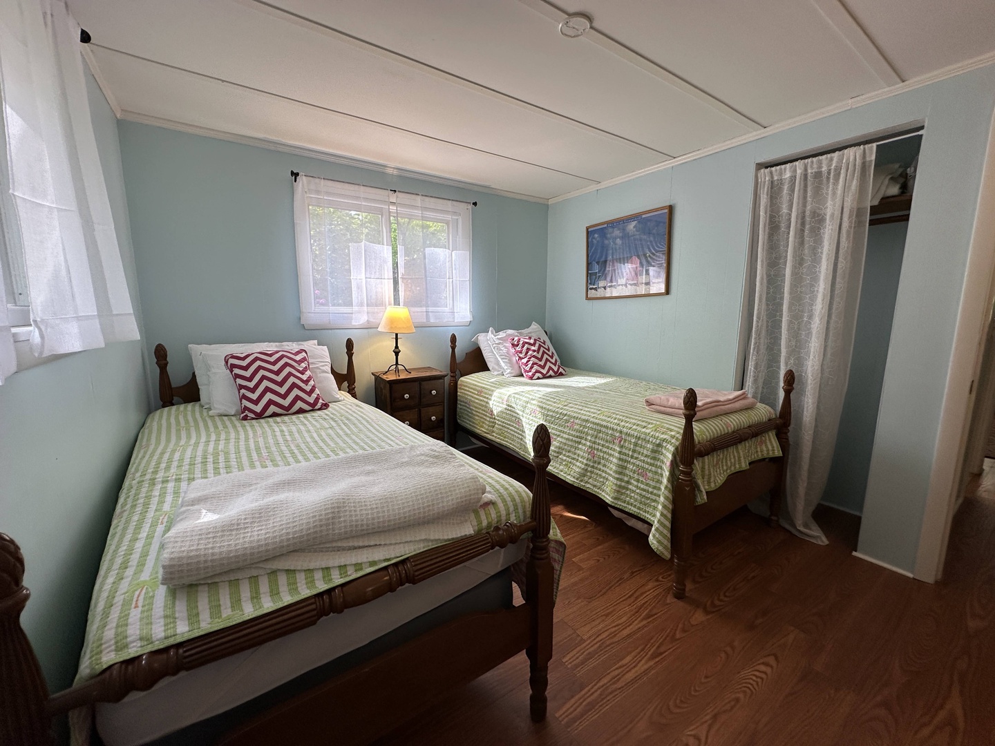 Sleep soundly in your charming twin bedroom with cozy striped linens and peaceful mint walls creating the perfect restful retreat.