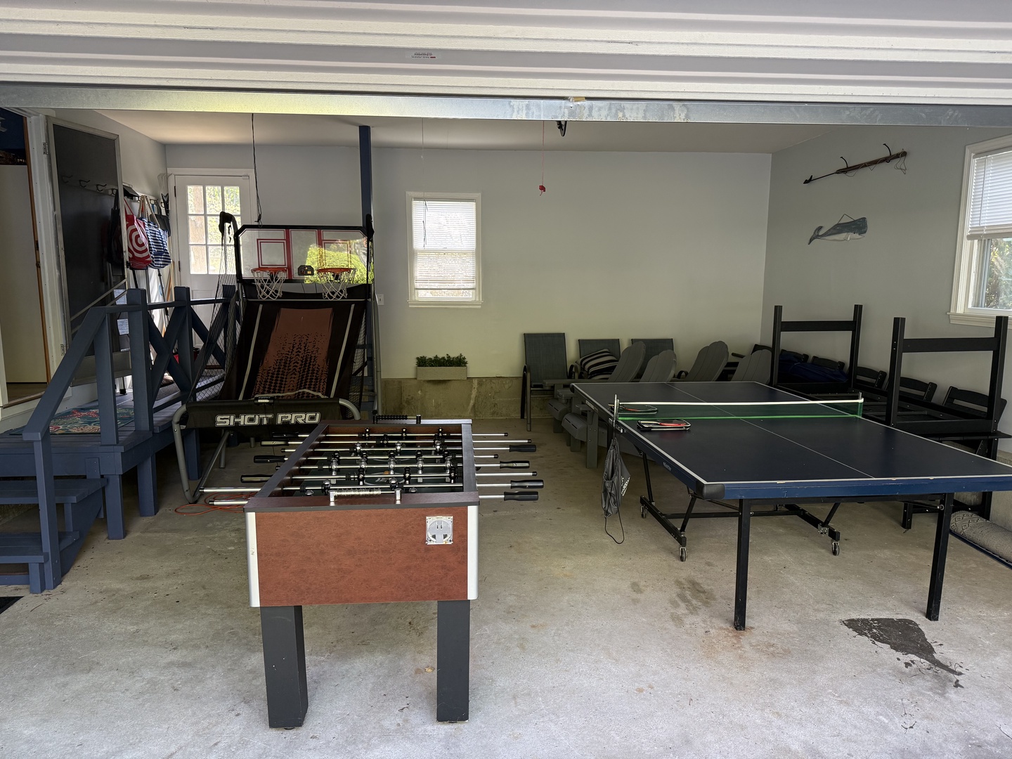 A bright game room awaits with foosball, table tennis, and a basketball hoop—your perfect retreat for friendly competition and fun-filled afternoons with friends or family.
