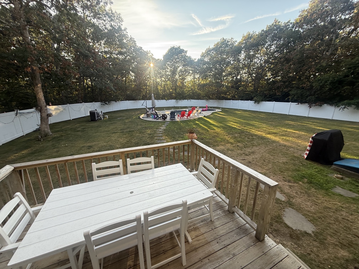 Your private deck overlooks a spacious backyard perfect for morning coffee and evening gatherings with friends and family.