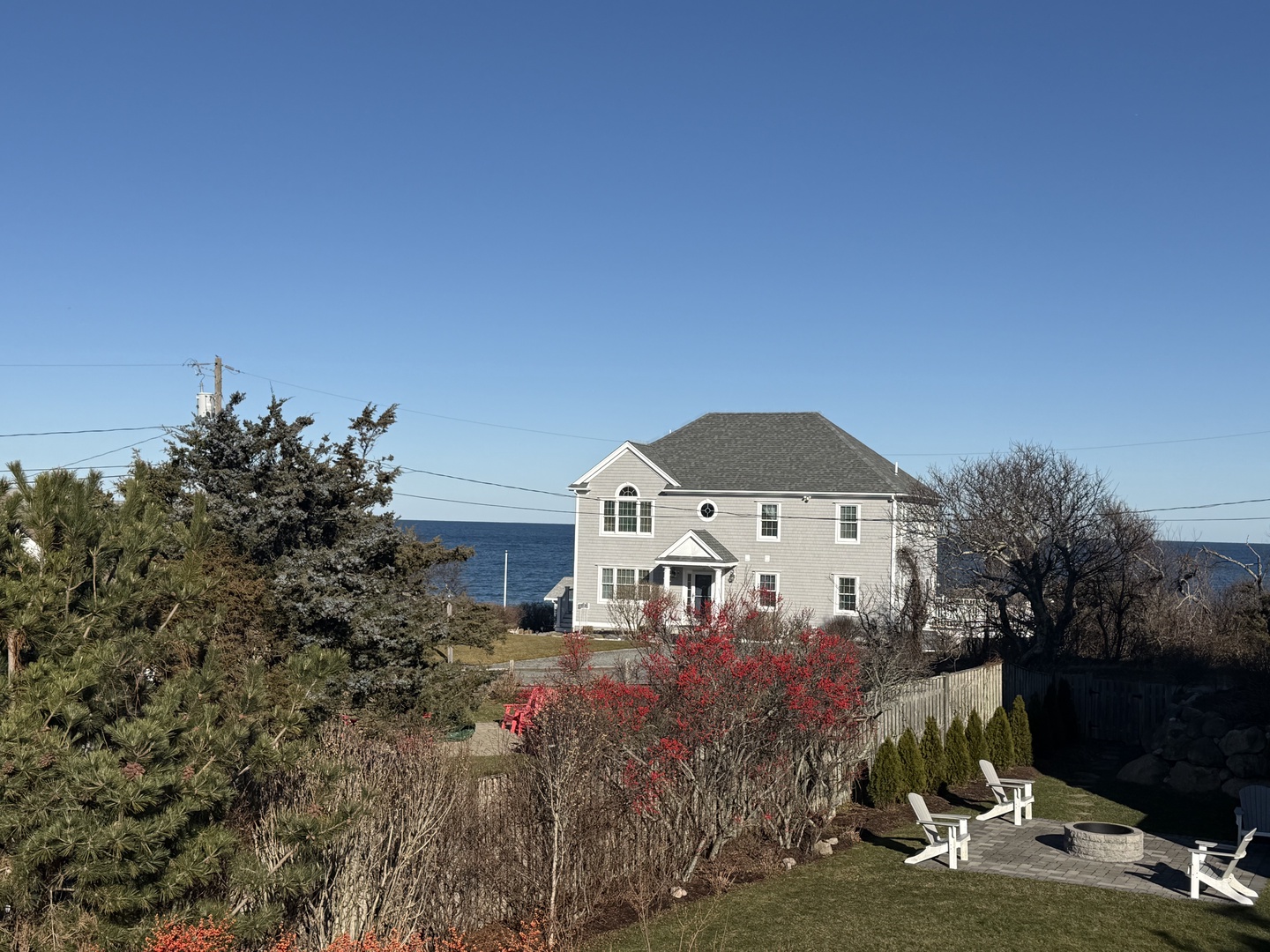 Coastal property with stunning ocean views and mature landscaping creates a peaceful waterfront retreat.