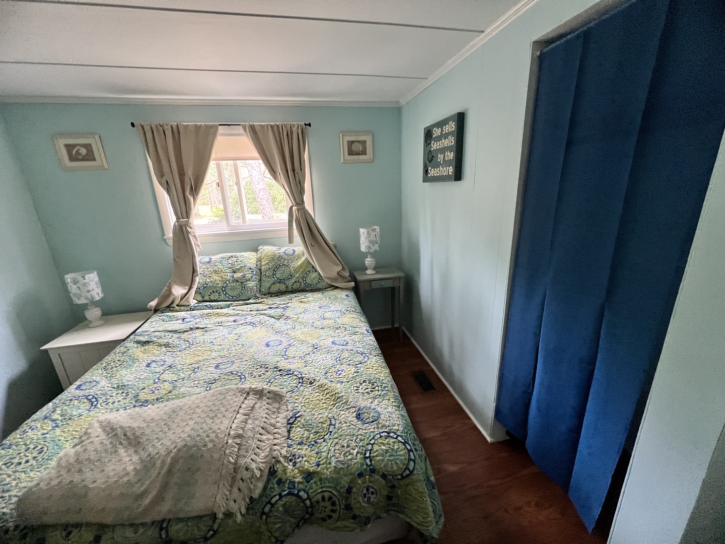 Drift off to sleep in this serene bedroom with soft linens and peaceful garden views streaming through your window.