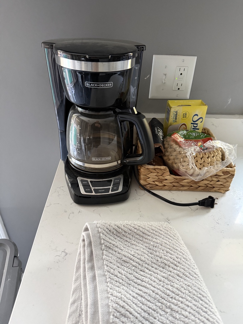 Wake up to the rich aroma of freshly brewed coffee from your personal coffee maker, complete with welcoming snacks and treats.