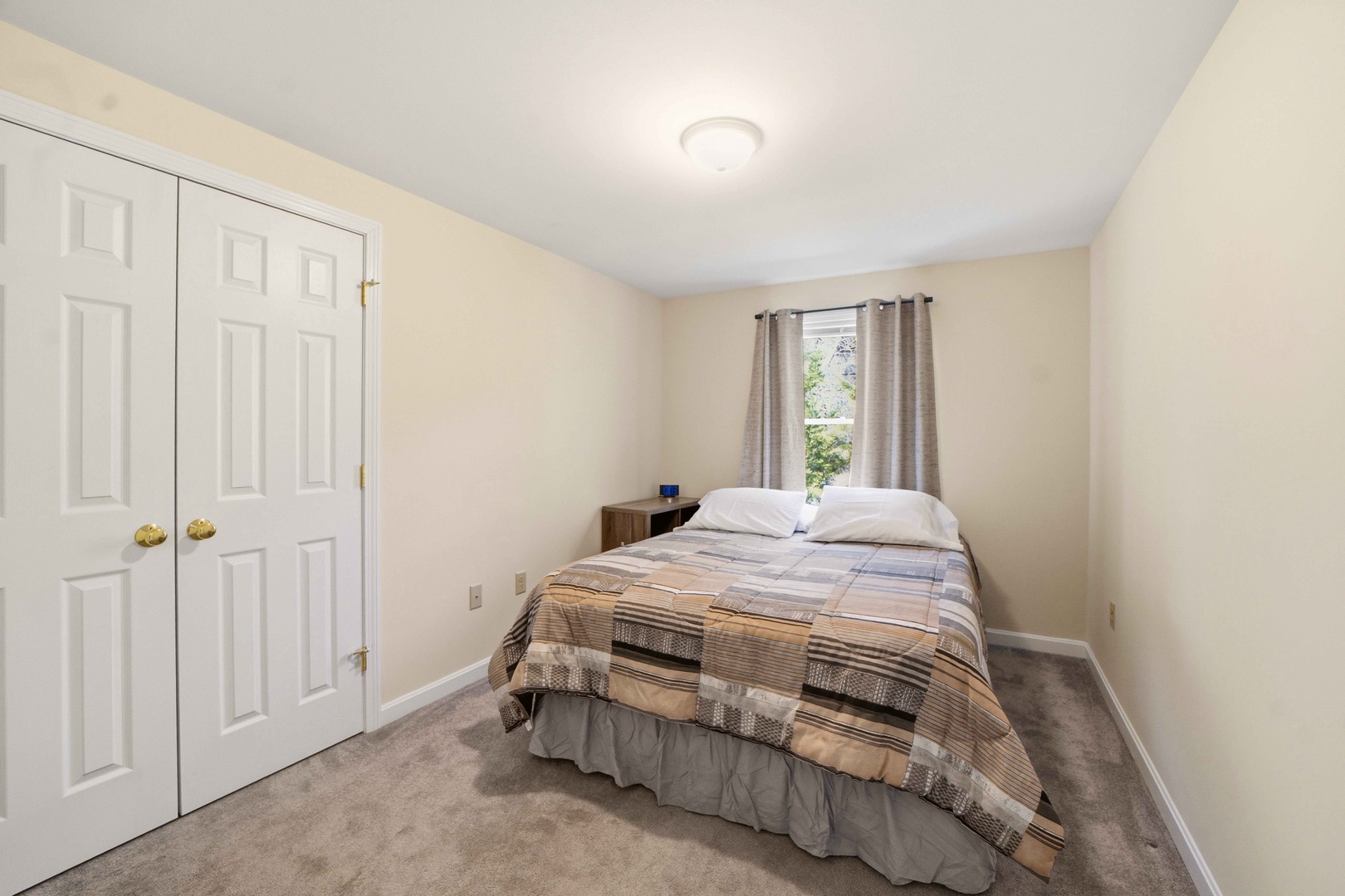 Rest peacefully in your cozy bedroom with soft linens, ample closet space, and natural light streaming through the window for a refreshing morning wake-up.