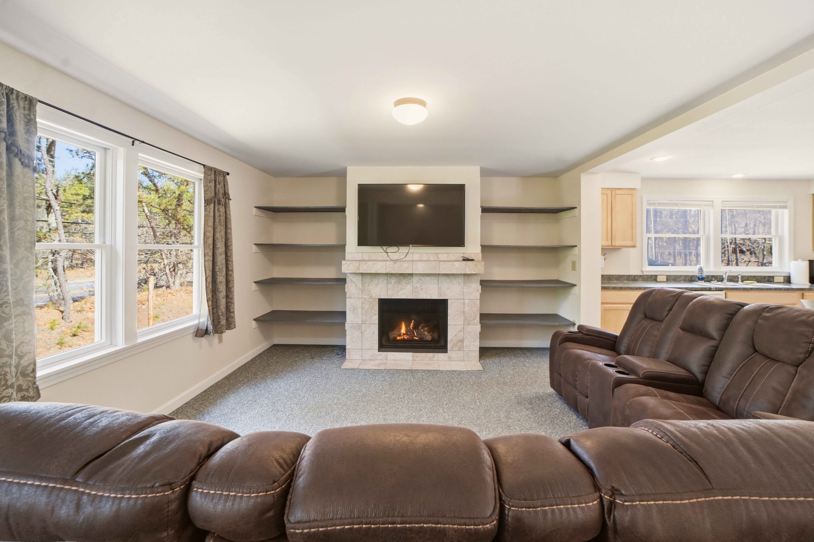 Sink into plush leather recliners as flames dance in your fireplace, creating the perfect atmosphere for movie nights.