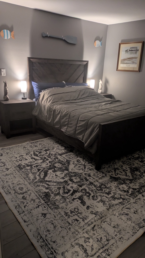 First floor master bedroom has a nice queen bed and smart TV