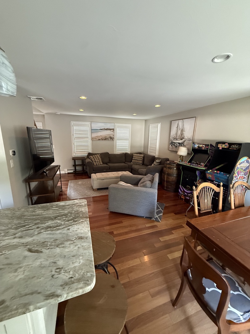 Unwind in your spacious living area with comfortable seating and elegant hardwood floors that invite relaxation after your adventures.