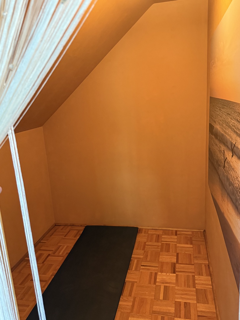 Relax in your private Yoga studio with warm wood finishes creating the perfect wellness retreat.