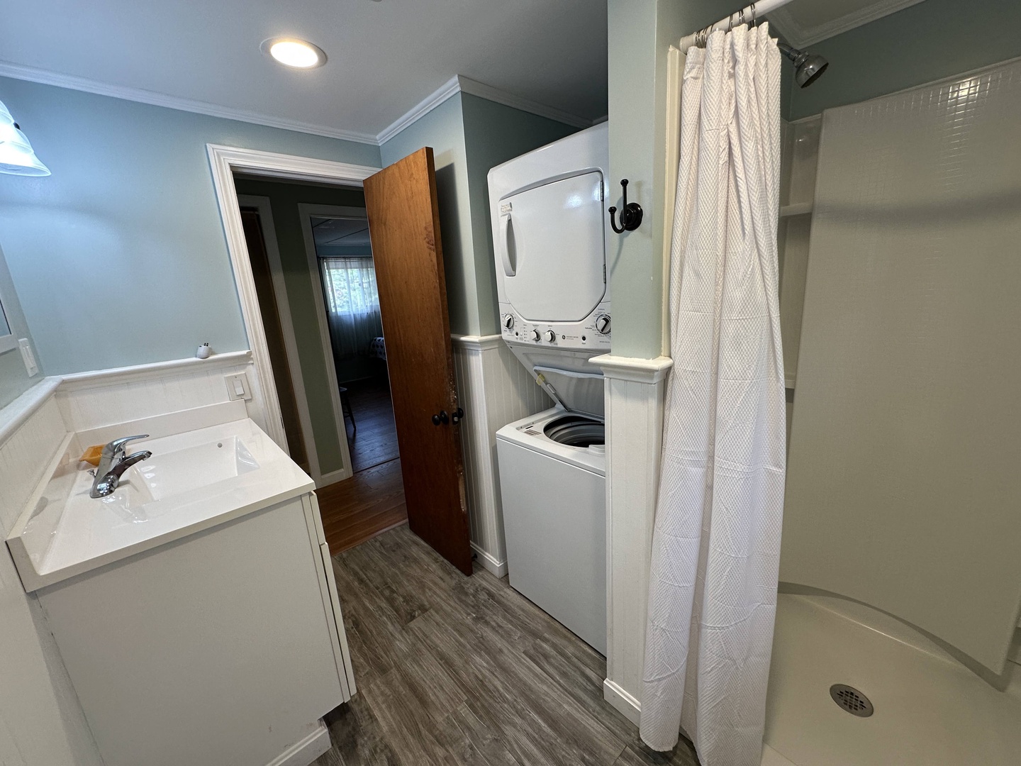 Your private bathroom features a relaxing soaking tub, walk-in shower, and convenient in-unit laundry for ultimate comfort during your stay.