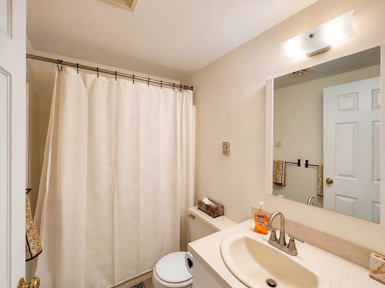 Your private bathroom offers a clean, well-lit space with soft linens and essential amenities to refresh after exploring the area.