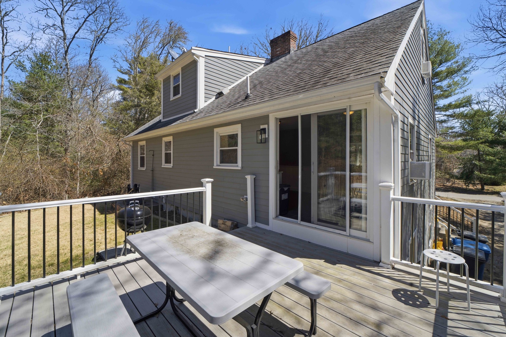 Step onto your private deck where outdoor dining meets woodland serenity, complete with BBQ for memorable evenings.