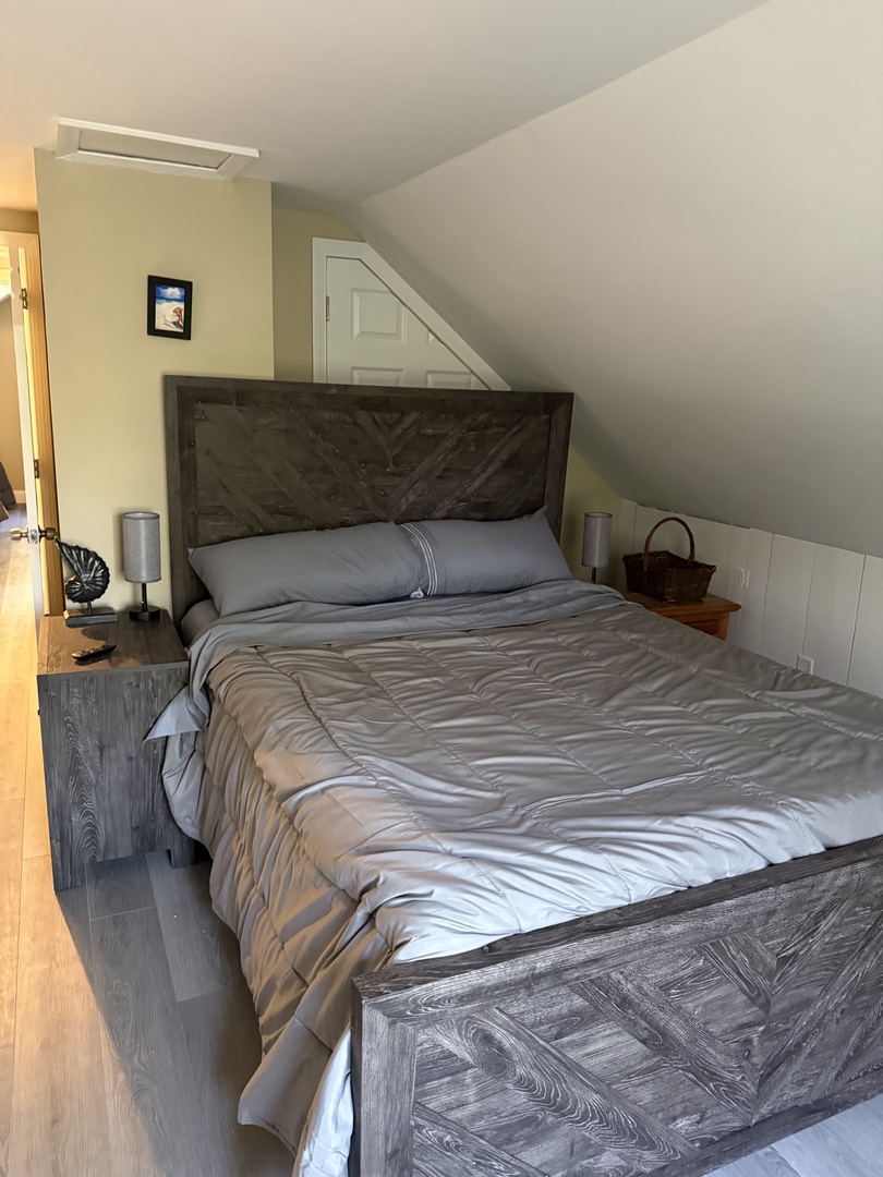 Sink into this plush bed with crisp linens and enjoy your peaceful retreat in this thoughtfully designed bedroom.