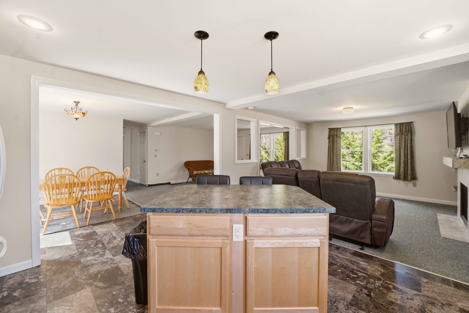 Gather around your spacious granite island while natural light streams through windows, creating the perfect heart for your mountain getaway.