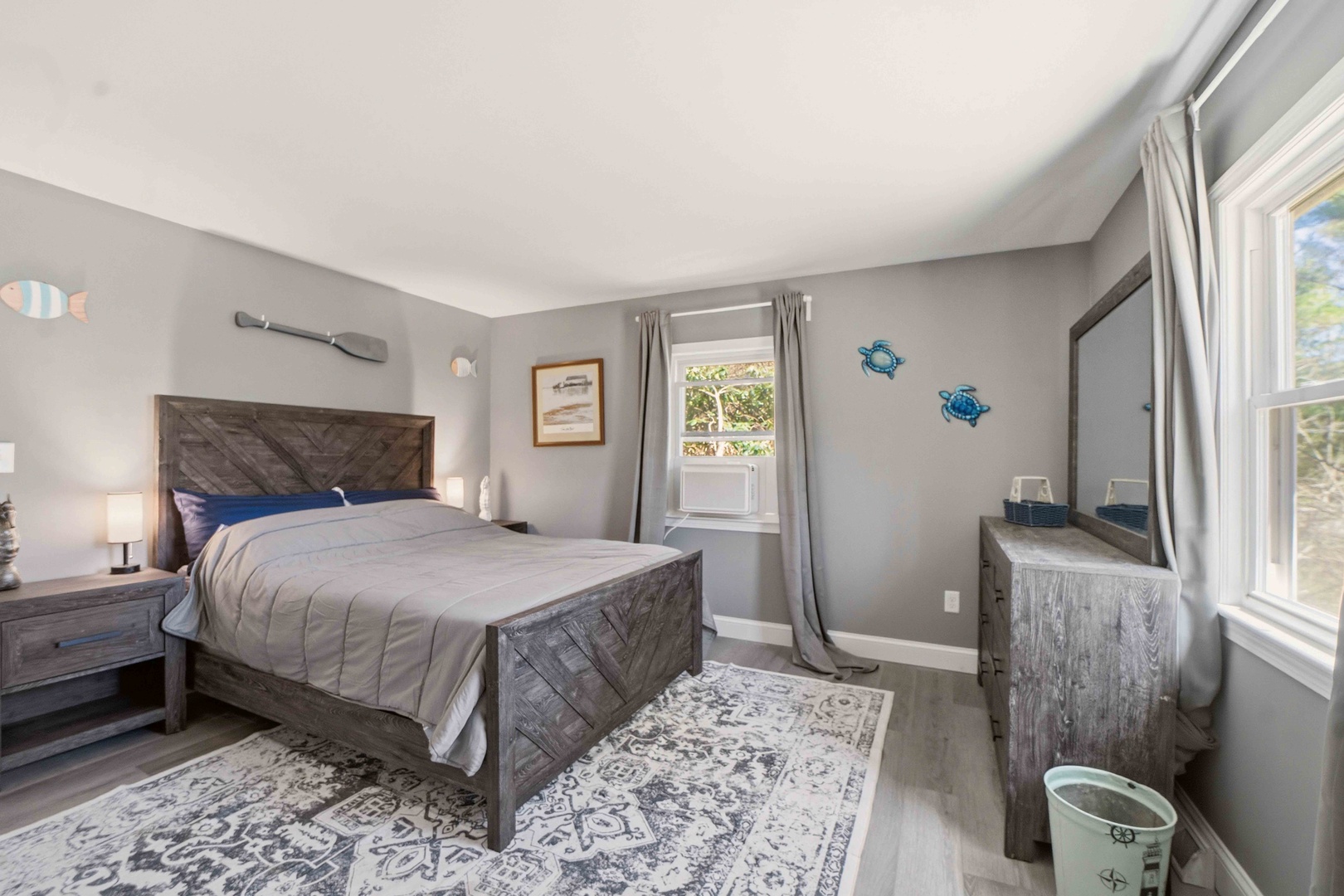 Drift off peacefully in your nautical-themed bedroom, where weathered wood meets ocean hues for the perfect coastal escape.