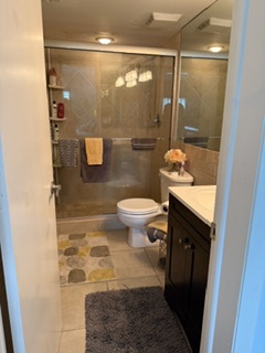 Step into your private retreat with a spacious walk-in shower, sleek glass enclosure, and warm towels waiting for you after a relaxing day.