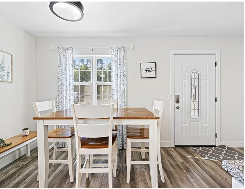 Step into your bright, welcoming dining space where natural light streams through large windows, perfect for morning coffee or evening meals with loved ones.
