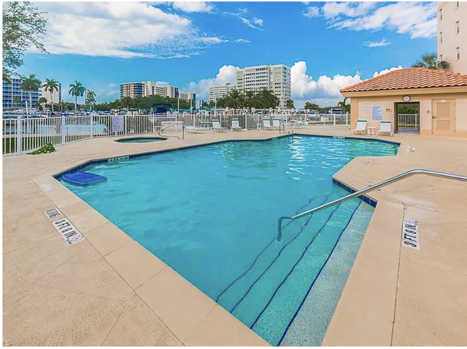 Take a refreshing dip in this sparkling waterfront pool, perfectly framed by swaying palms and calm bay waters just steps away.