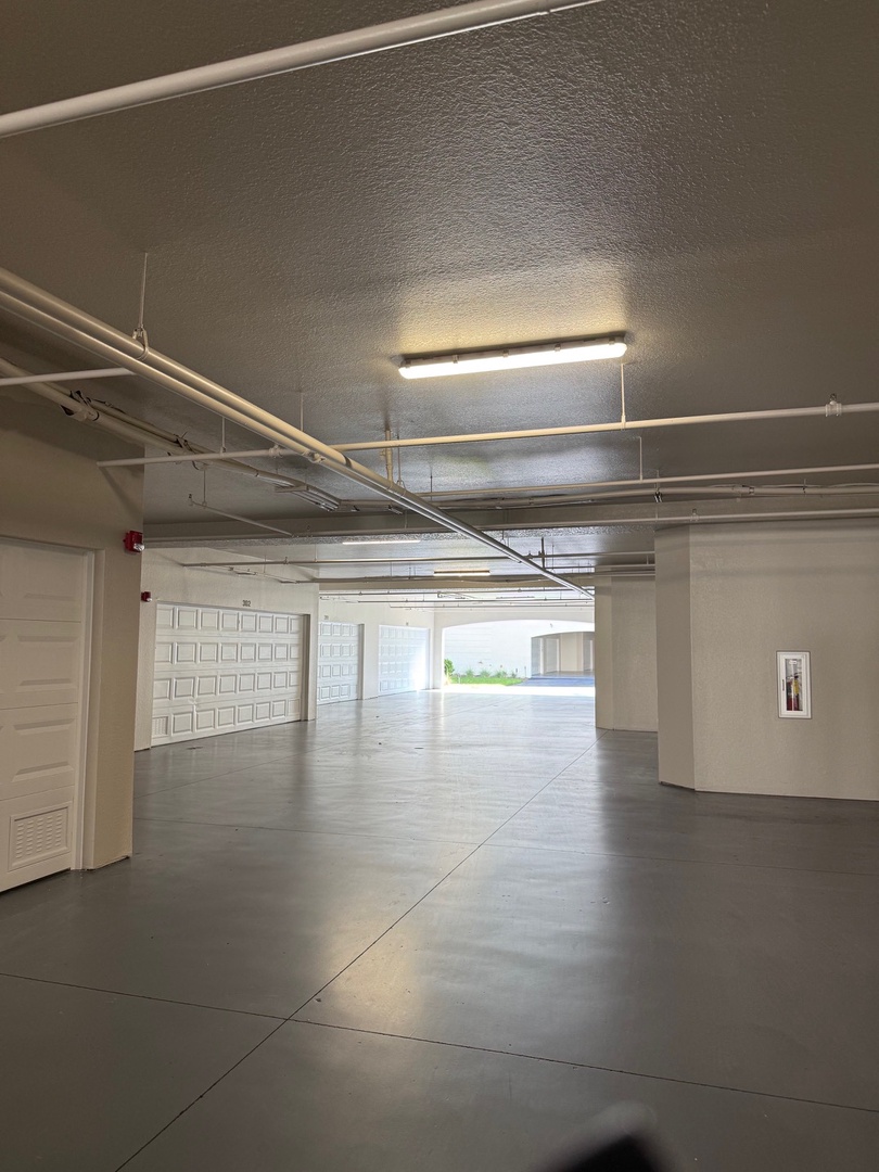Step through your private entrance into a bright hallway that leads you home, with sunlight streaming through the door ahead—welcoming you to your peaceful retreat.