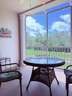 Your private balcony offers a peaceful spot to enjoy morning coffee or unwind with a view of lush greenery and open skies. Comfortable seating invites you to relax and soak in the serene surroundings.